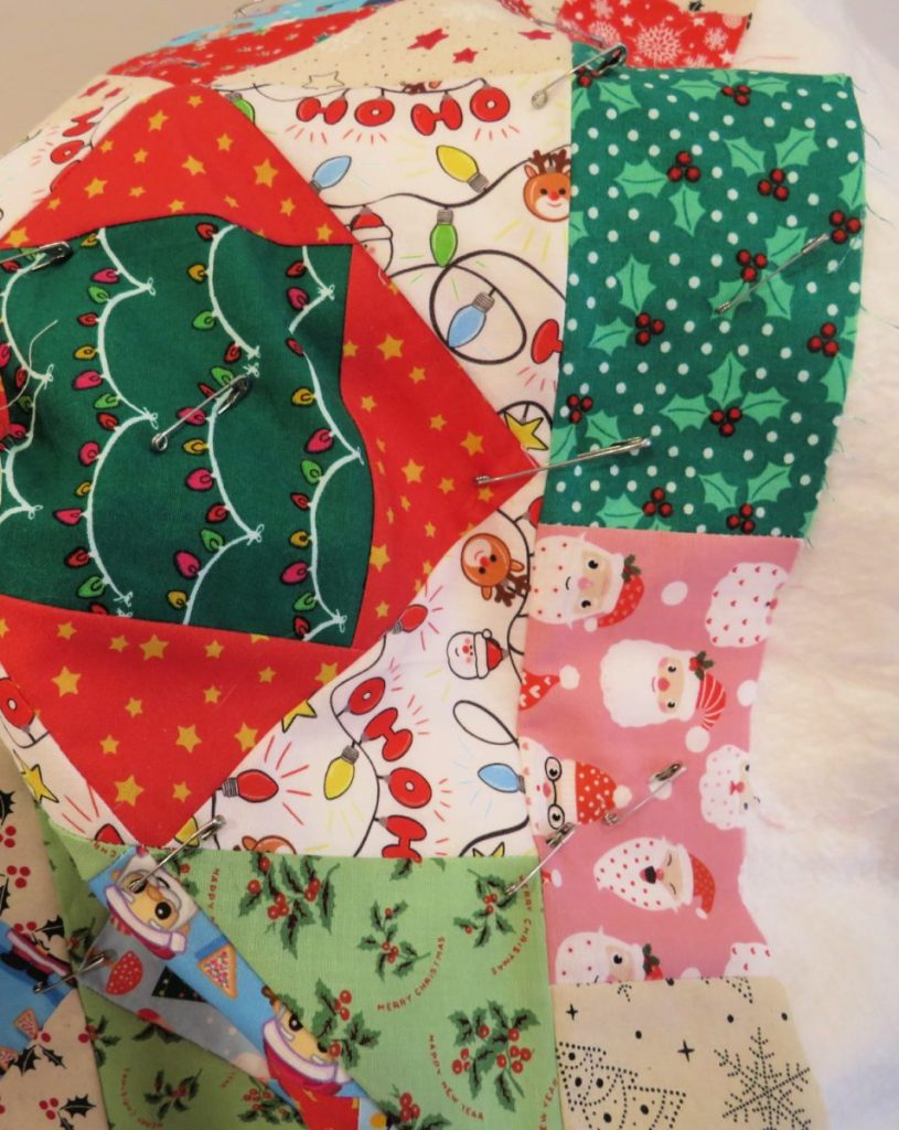 Scrappy border on the Christmas quilt