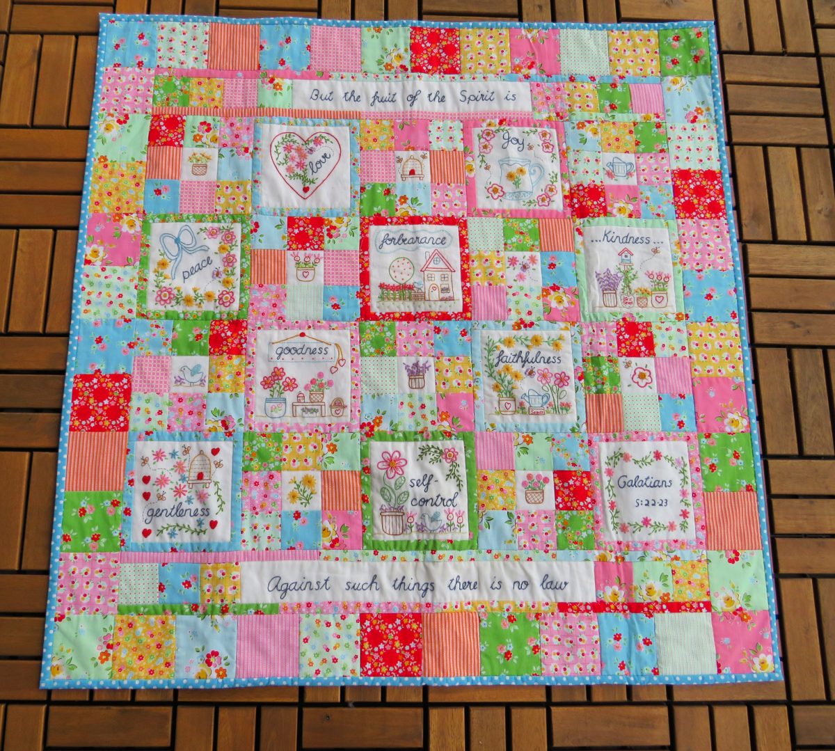 A scrappy quilt based on the Fruit of the spirit