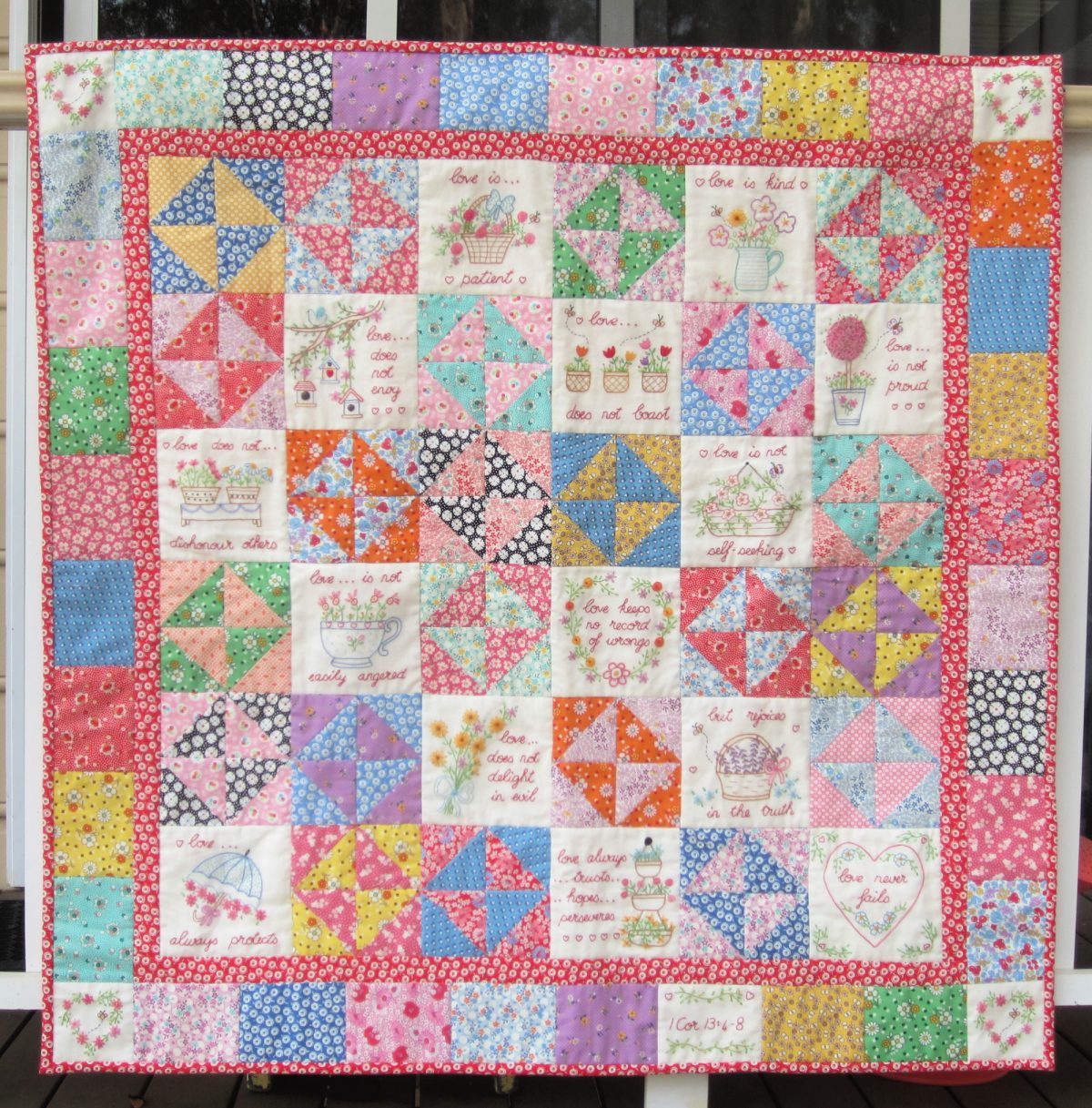 Love Blooms, a scrappy quilt showcasing 1 Cor 13